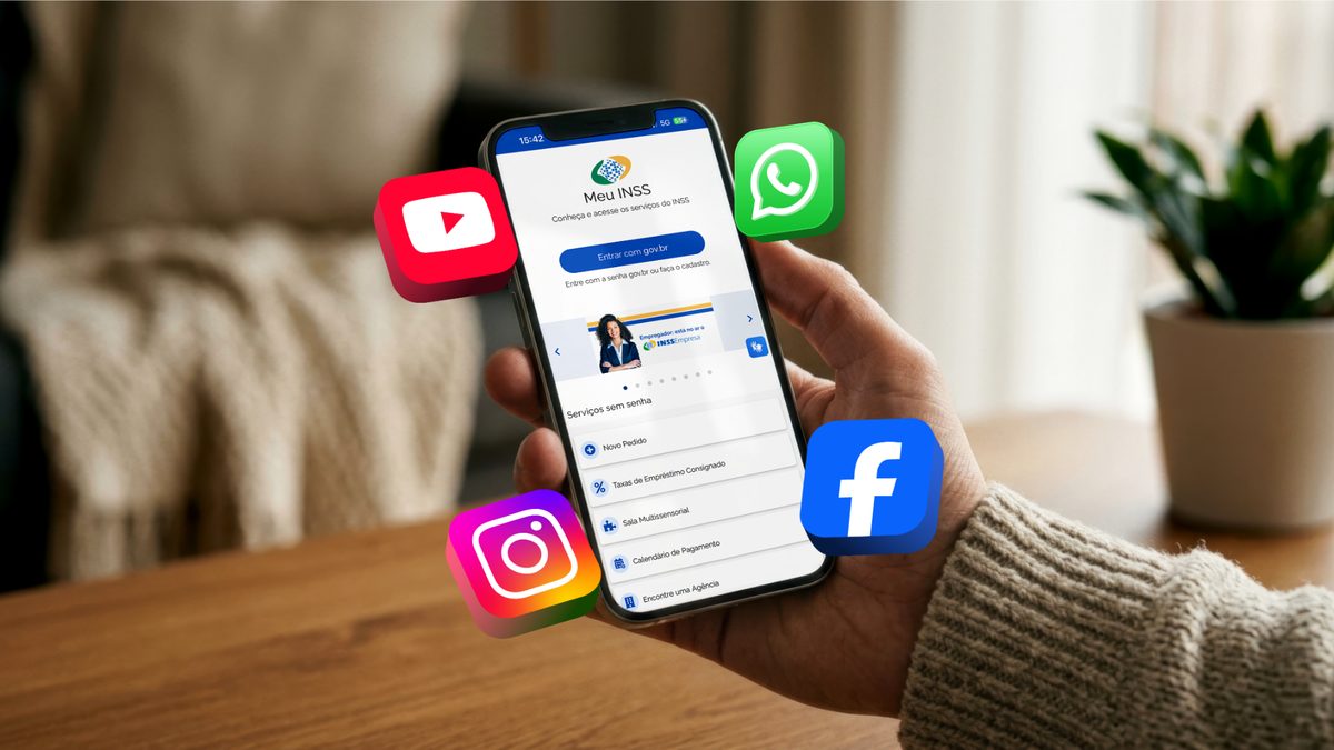 Mão segura celular com a tela inicial do Meu INSS, com ícones do WhatsApp, Instagram, Facebook e YouTube ao redor